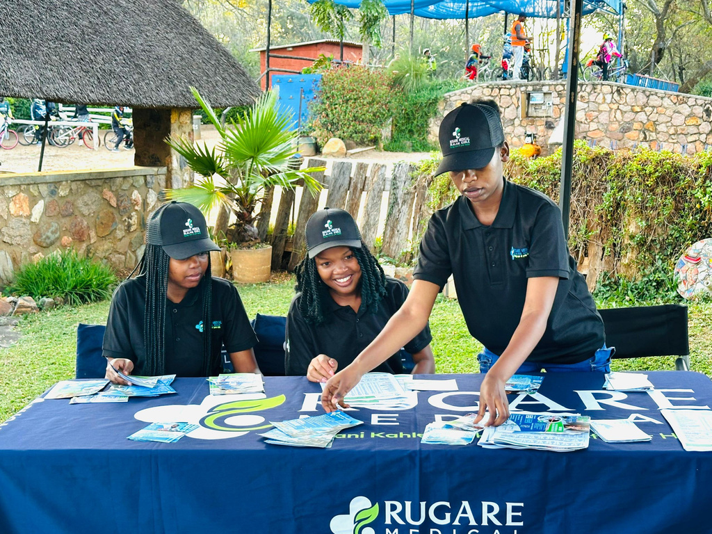 Rugare Medical team members arranging health information at a community event