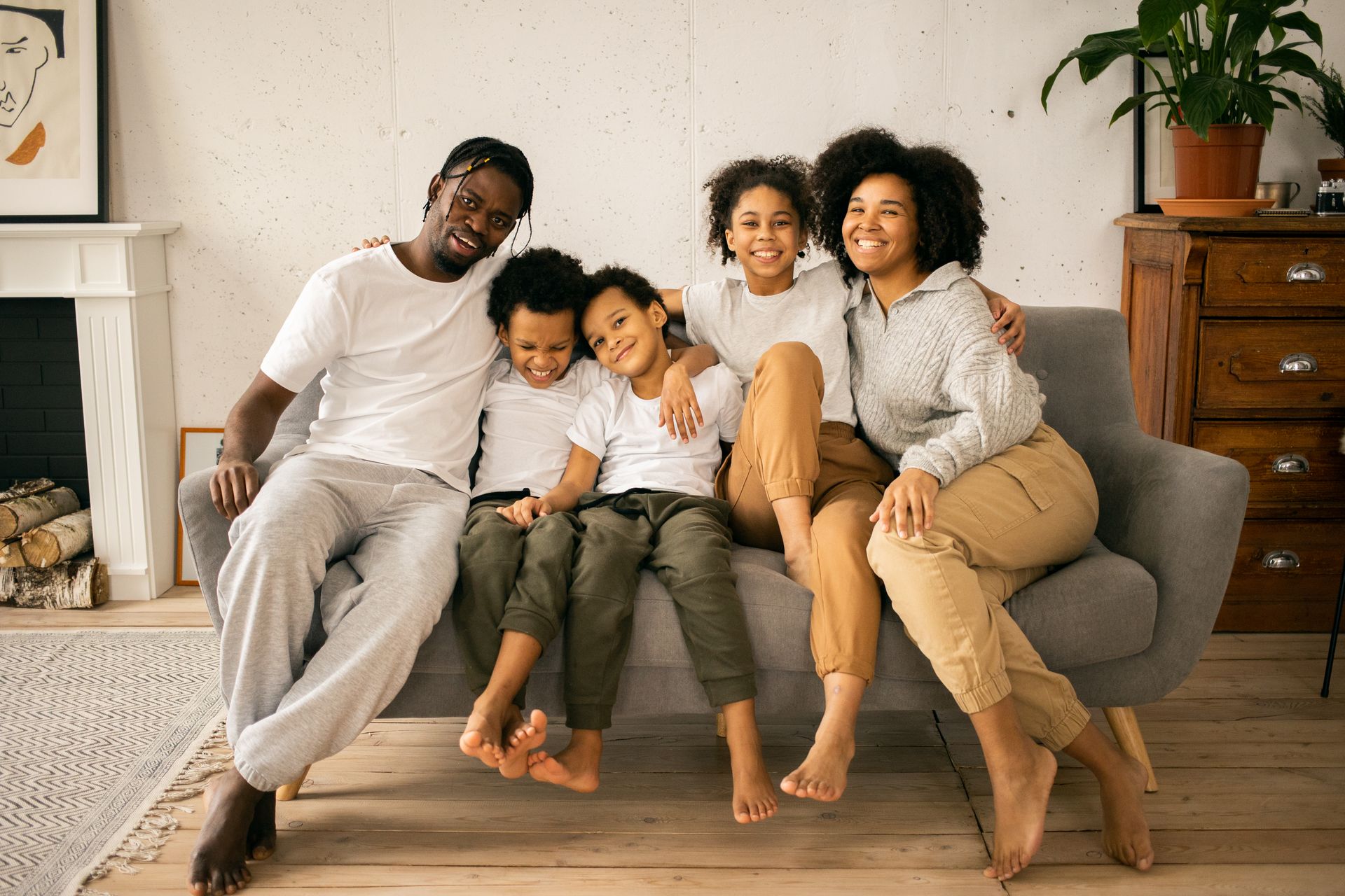 A Black family spending time together in their home