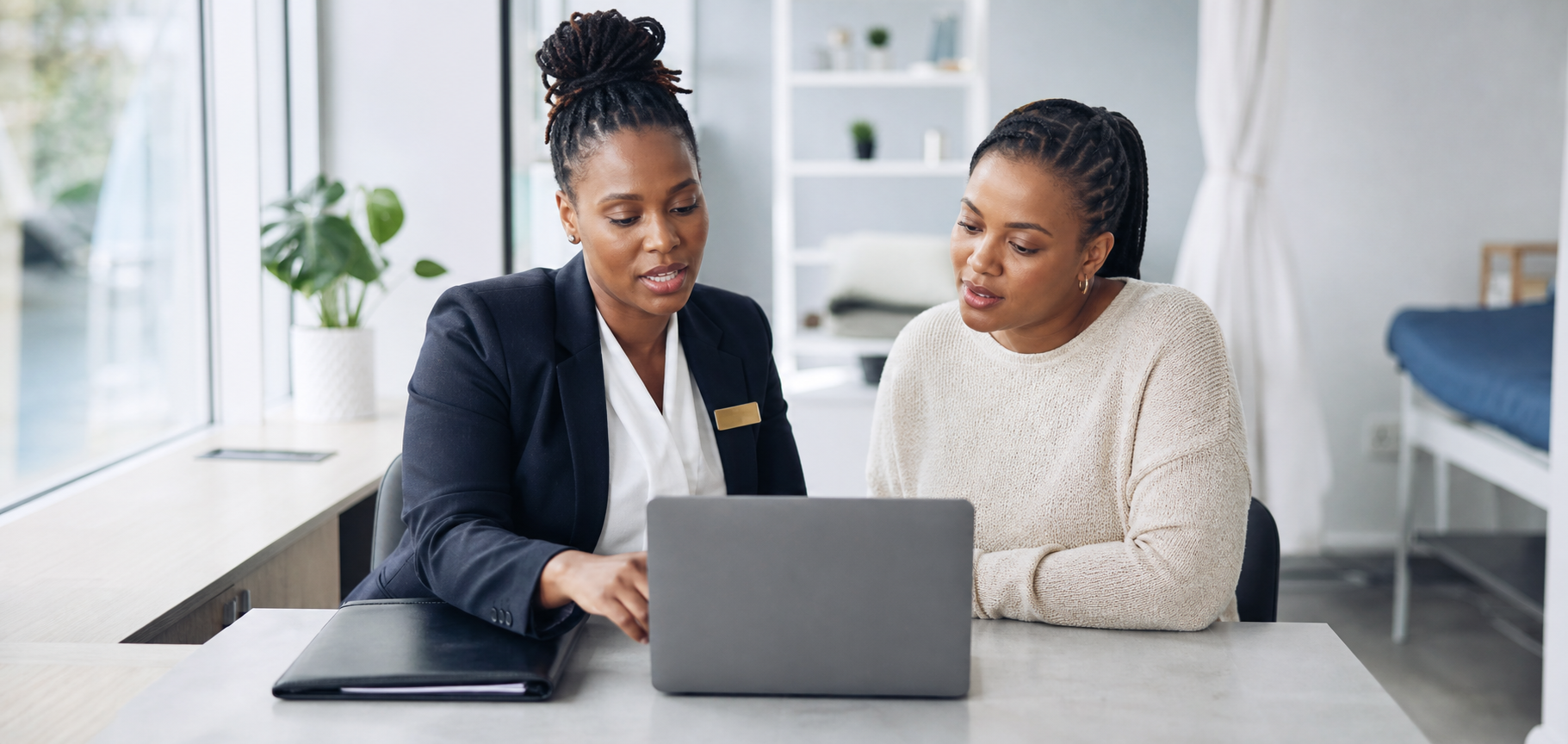 A healthcare professional guiding a patient through a medical insurance application