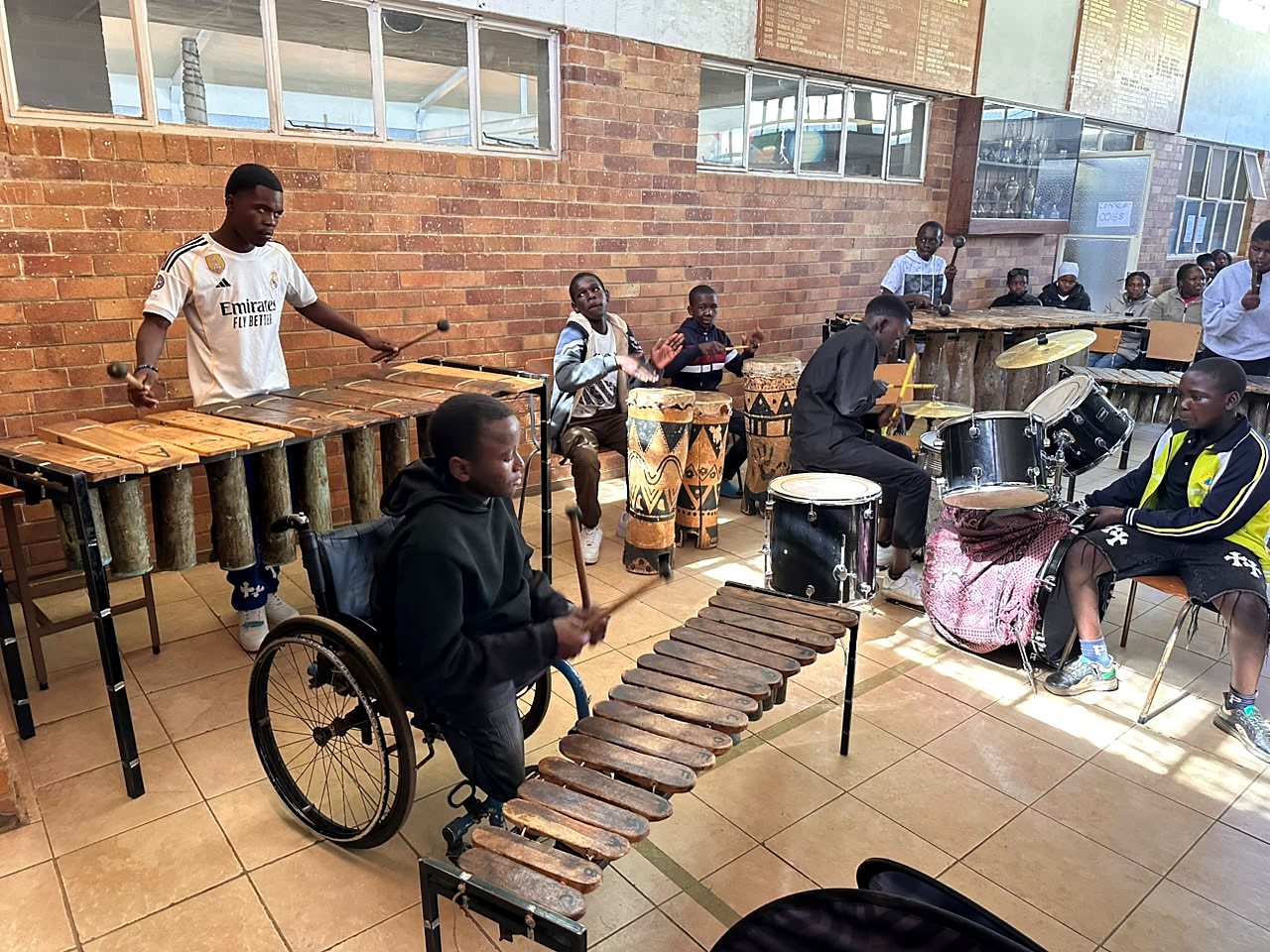 Musicians including wheelchair users taking part in a community performance