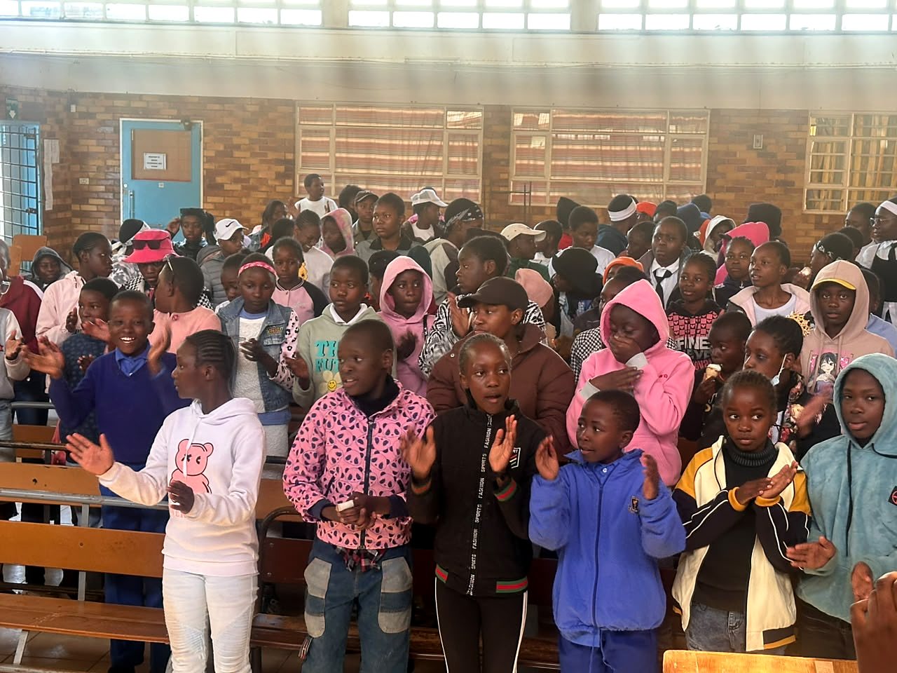 Children and young people gathered during a community activity