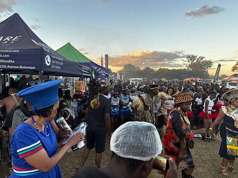 A community health conversation taking place during a cultural gathering
